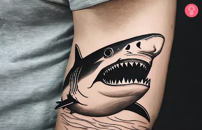 White shark tattoo on the arm of a man