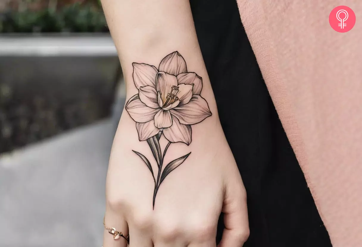 Woman flaunting a narcissus tattoo on her hand