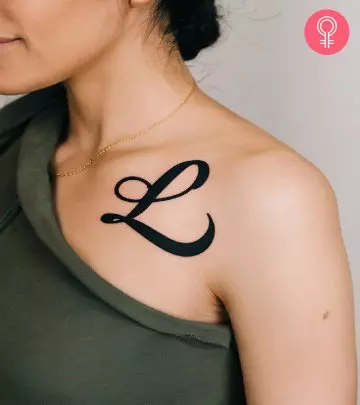 Woman with L initial tattoo on her arm