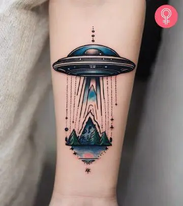 An atom tattoo design on the arm of a woman