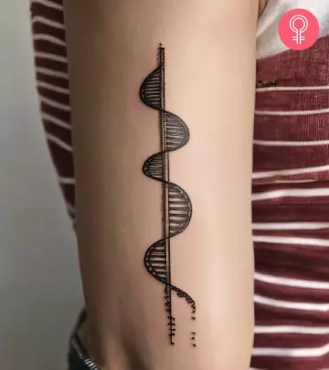 A man with a barcode tattoo design on his wrist