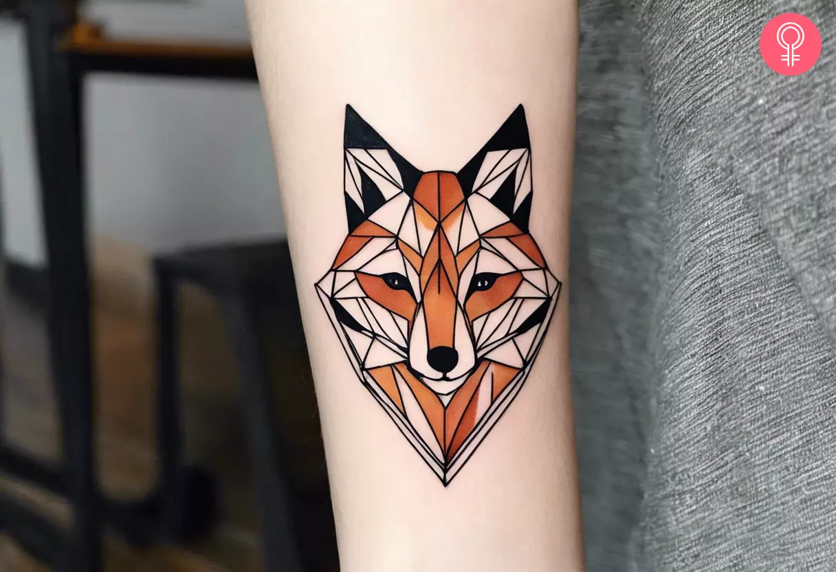 Woman with a geometric fox tattoo on the forearm