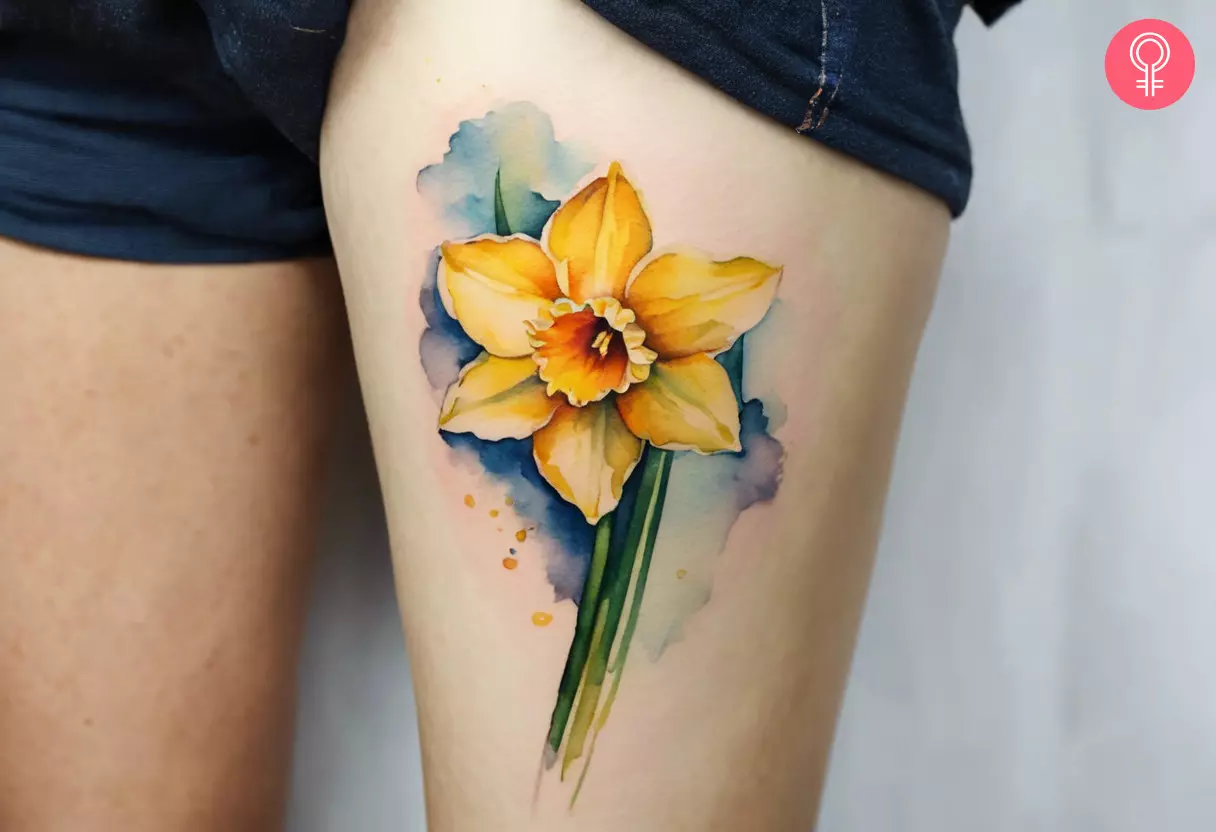 Woman with a narcissus tattoo on the leg