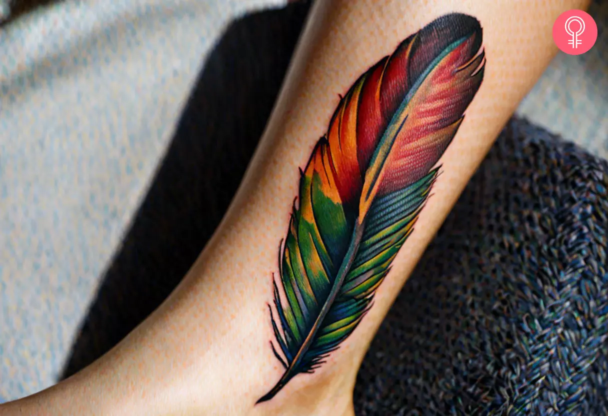 Woman with a parrot feather tattoo on her ankle