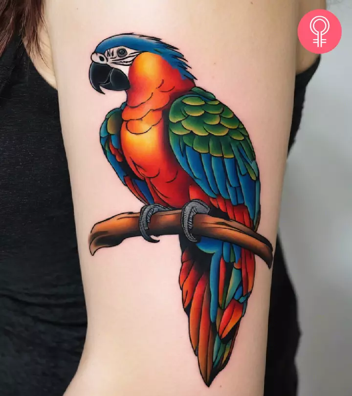 Woman with a parrot tattoo on her arm