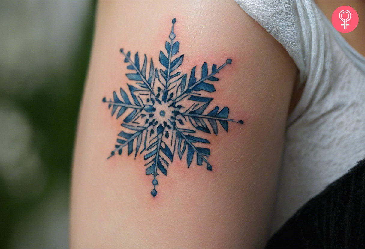 Woman with a realistic snowflake tattoo