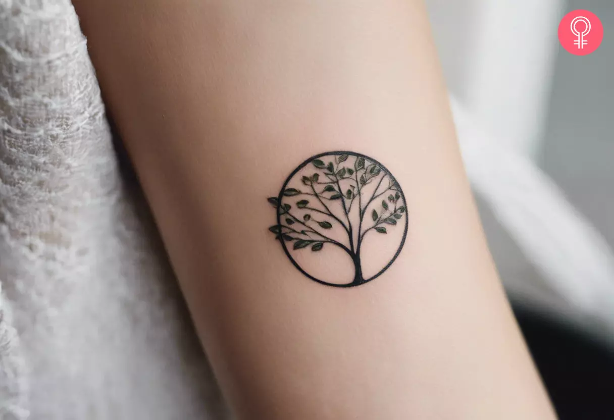 Woman with a small Mother Nature tattoo on the forearm