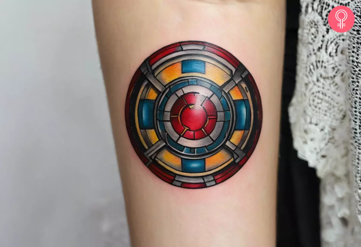 Woman with an Iron Man arc reactor tattoo on her forearm