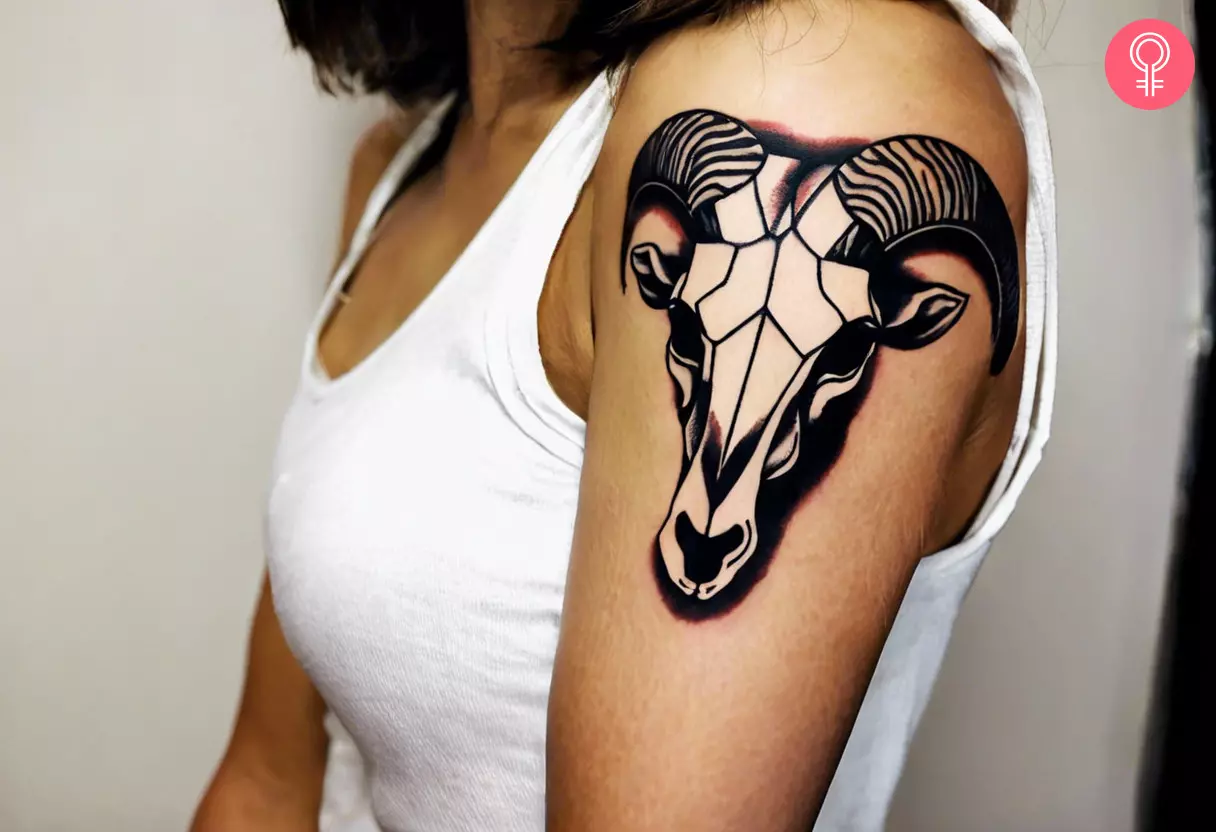 Woman with animal skull tattoo on her outer arm