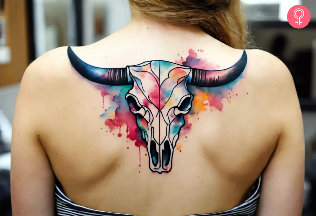 Woman with bull skull tattoo on her upper back