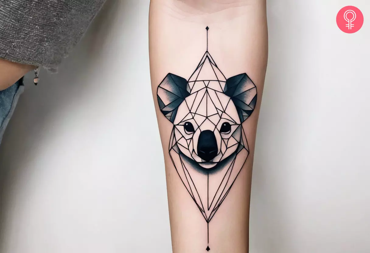 Woman with koala in geometric design tattoo on her forearm