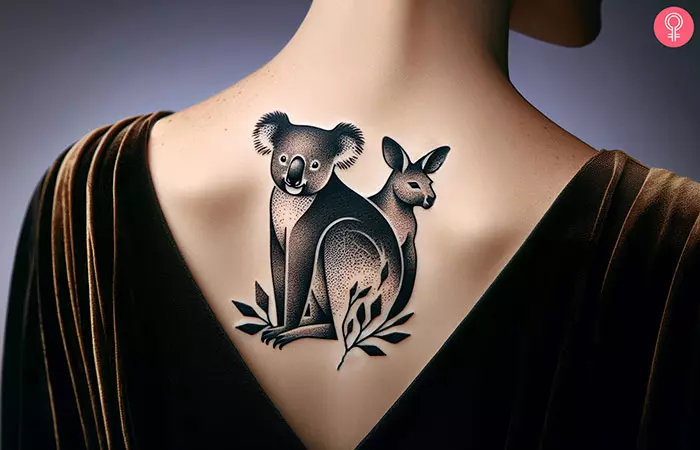 Woman with koala with other animals tattoo on the upper back