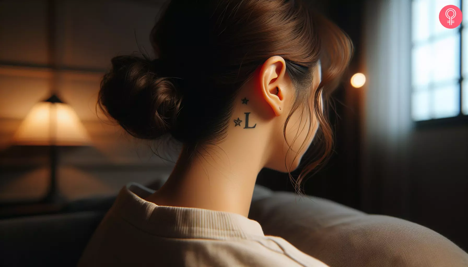 Woman with l and star tattoo behind the ear