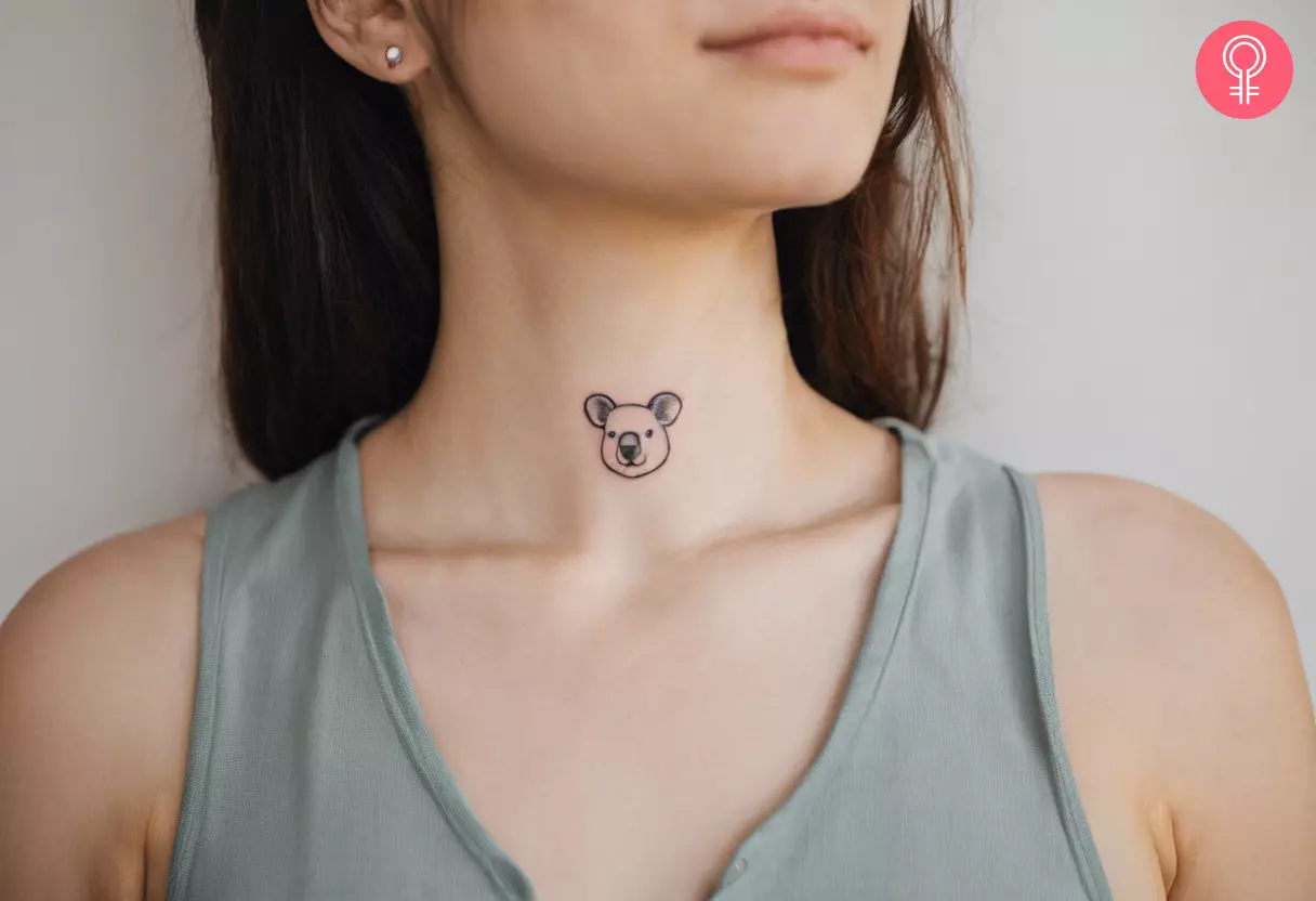 Woman with minimalist koala tattoo on her neck