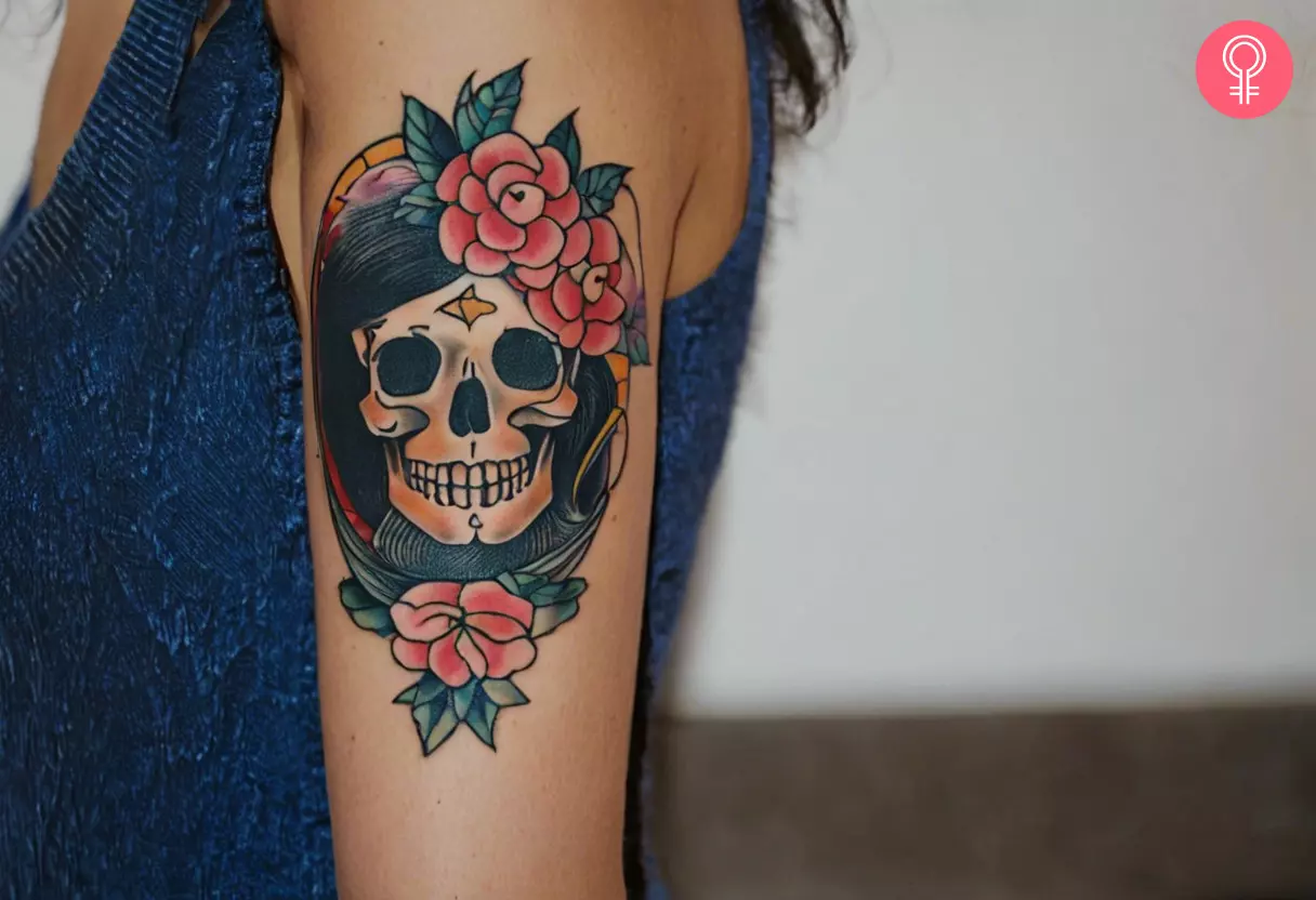 Woman with old school skull tattoo on her arm