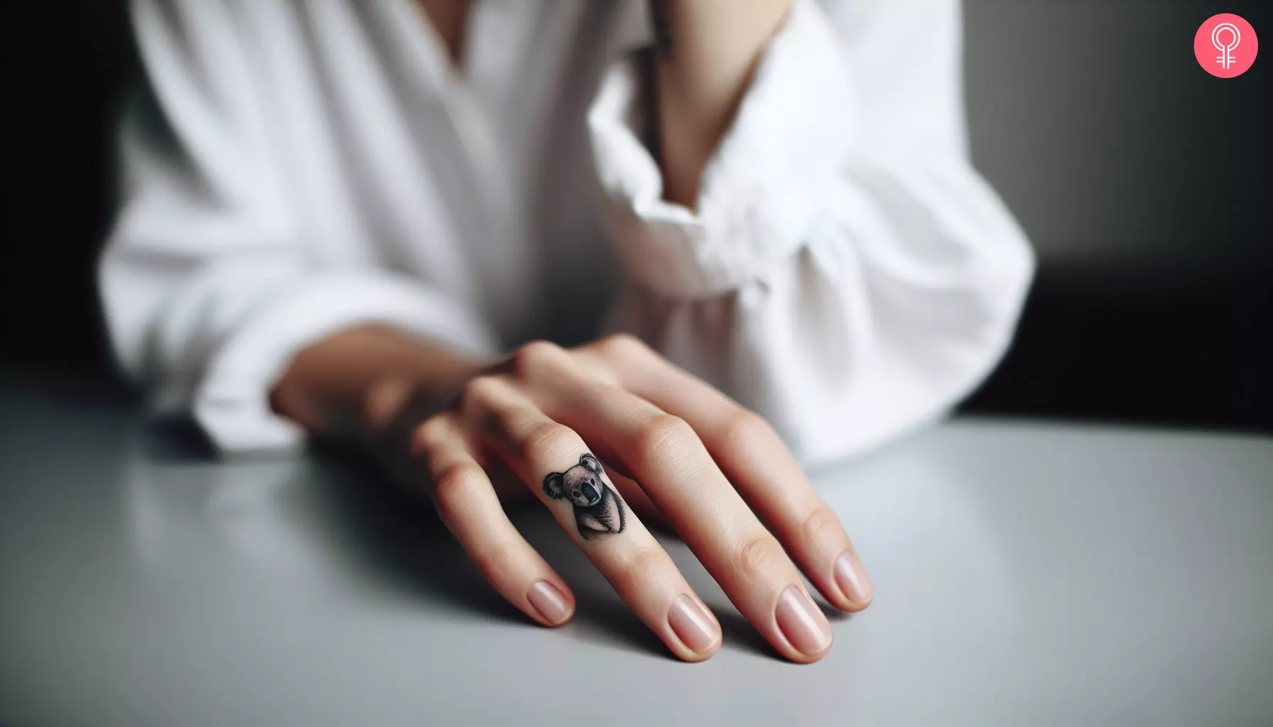 Woman with small koala tattoo on her finger