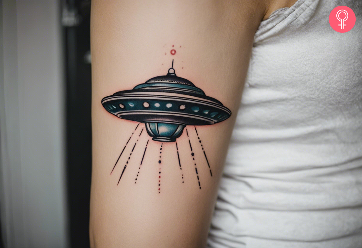 Woman with traditional UFO tattoo on her arm