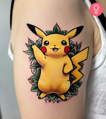 A woman with a black biohazard tattoo on her upper arm