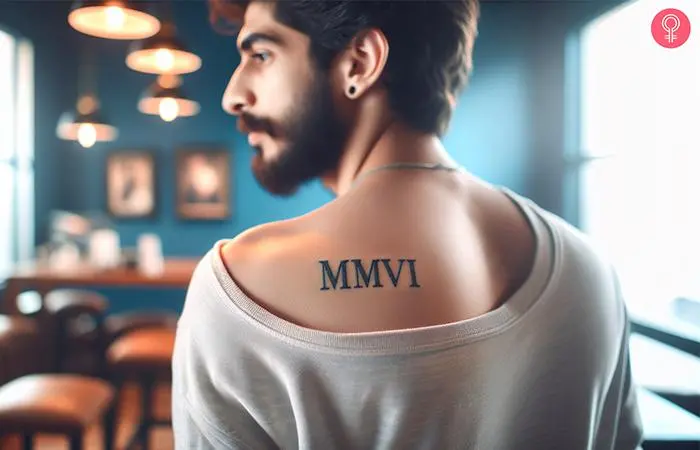 2006 Roman numerals tattoo on the upper back of a man