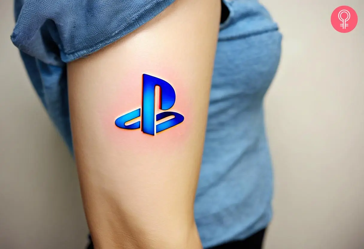 A 3D PlayStation tattoo on a woman’s arm