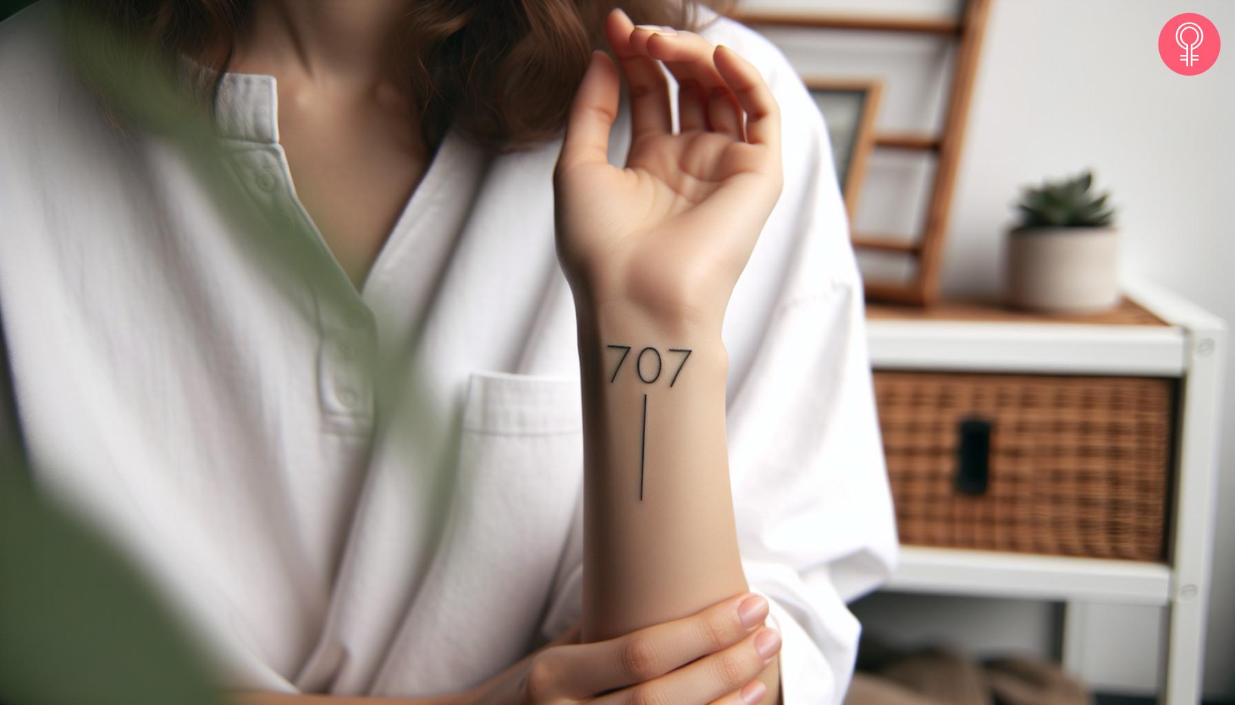 A 707 area code tattoo on the wrist of a woman