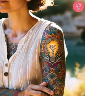 A brain tattoo on a woman’s upper arm