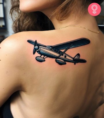 Woman with an airplane tattoo on her neck
