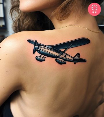 A woman with a spark plug engineering tattoo on her upper arm