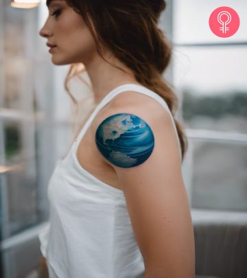 A planet tattoo on a woman’s arm