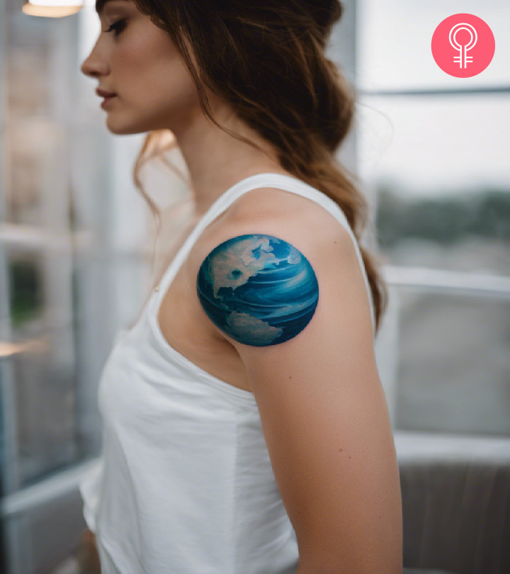 A Neptune tattoo design on the arm of a woman