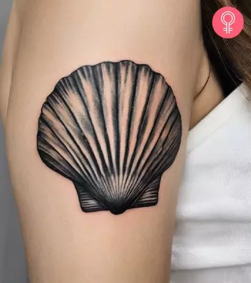 A lung tattoo on a woman’s upper arm