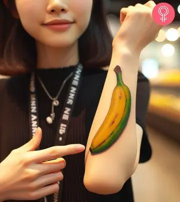 Woman with peacock feather tattoo on her forearm