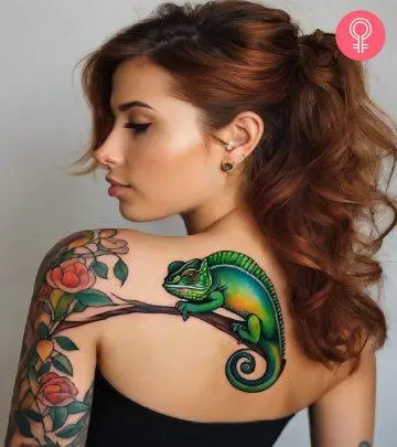 An intricate tattoo on the upper arm of a woman