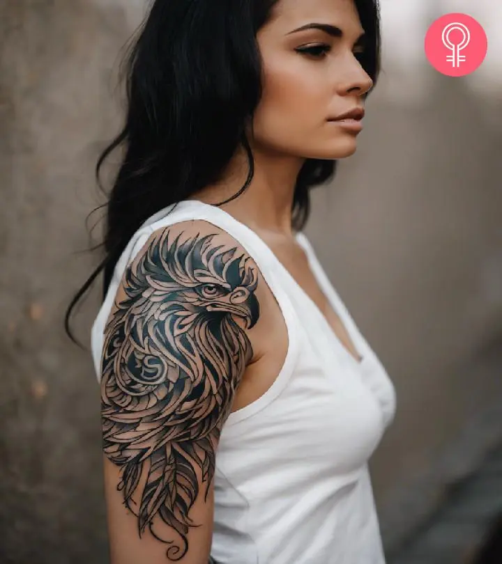 A griffin head tattoo on a woman’s upper arm