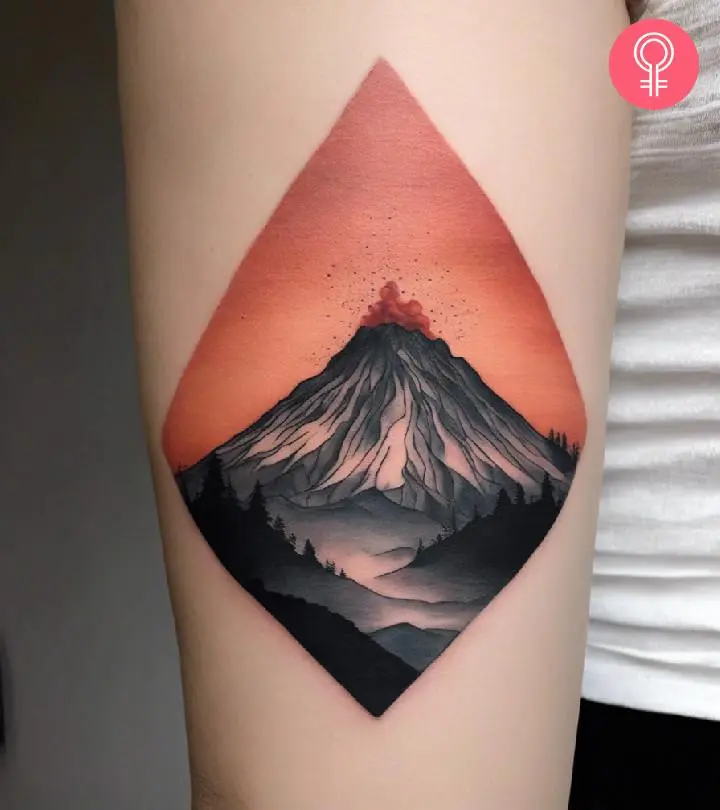 A woman wearing a minimalist volcano tattoo on the lower arm