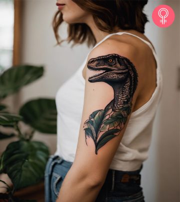 A woman with a dinosaur tattoo on her arm