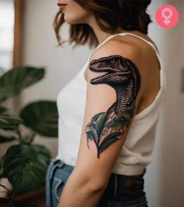 A Godzilla tattoo design on a woman’s arm