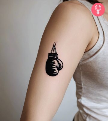 A boxing tattoo on the upper arm