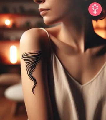 A woman with a thunderstorm tattoo on her upper arm