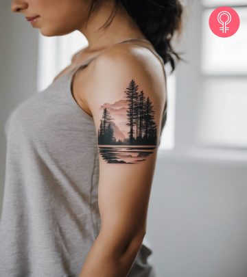 Camping tattoo on the upper arm