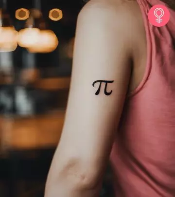 An alphabet tattoo on a woman’s upper arm