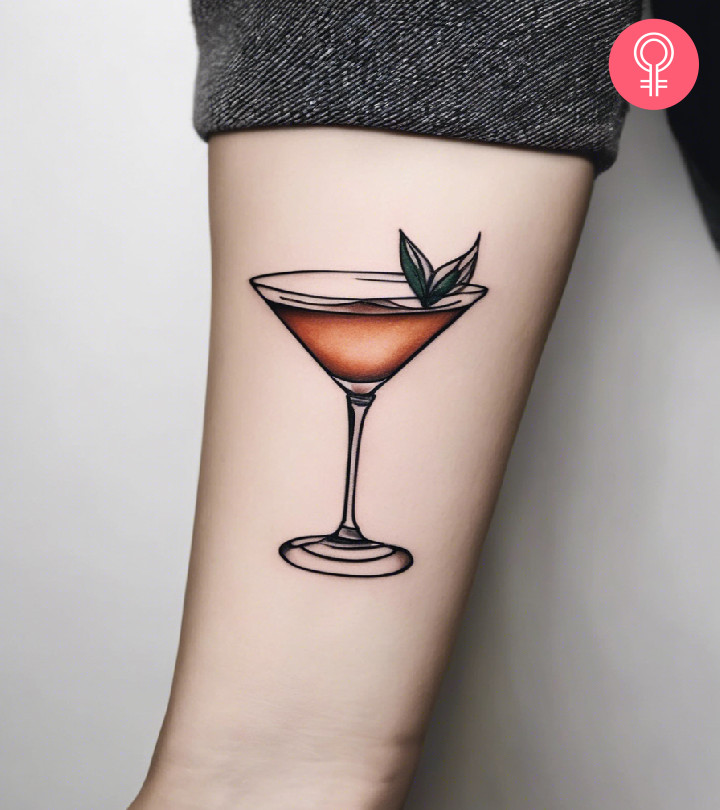 A woman sporting a cocktail tattoo on the forearm