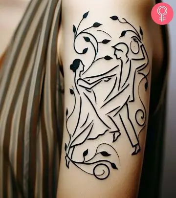 Woman with a dancing couple tattoo on her upper arm