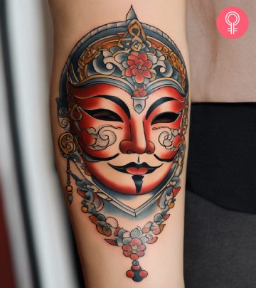 A woman with a Japanese Oni demon tattoo on her upper arm