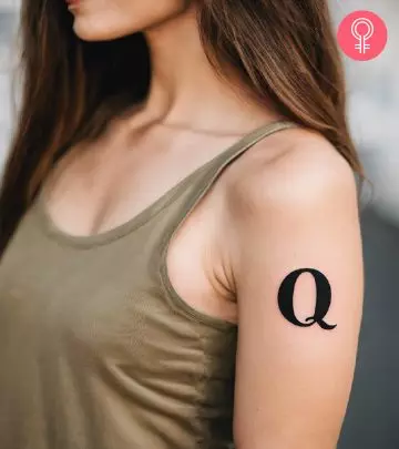 Woman with Q tattoo on her arm