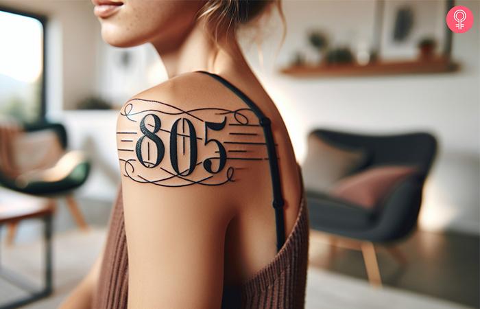 An 805 area code tattoo on the shoulder of a woman