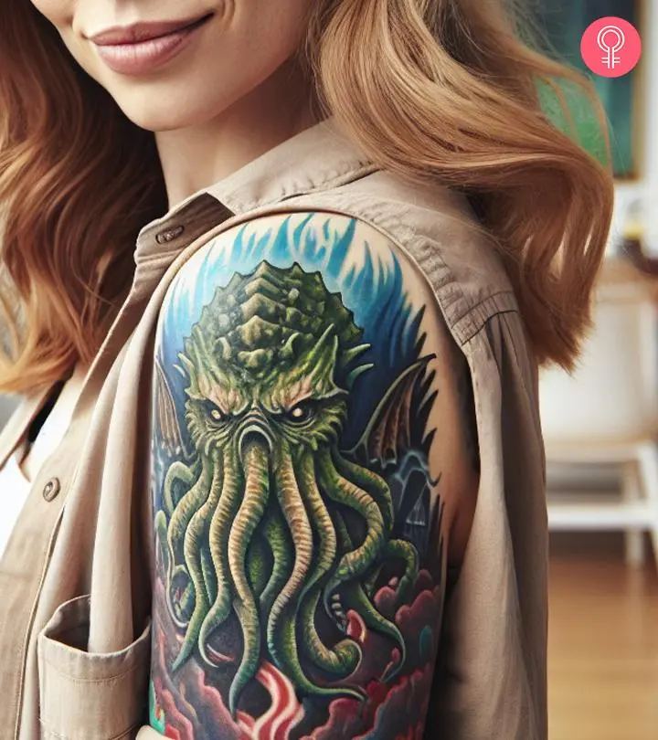 A Cthulhu tattoo on a woman’s upper arm