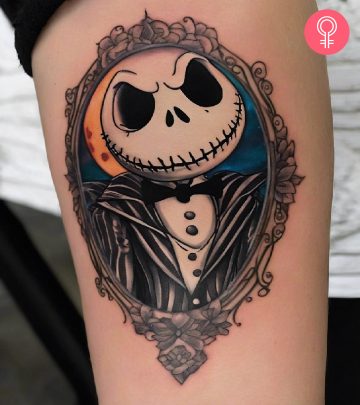 A colorful Jack and Sally arm tattoo