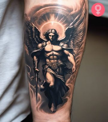 A victory tattoo on the upper arm of a woman