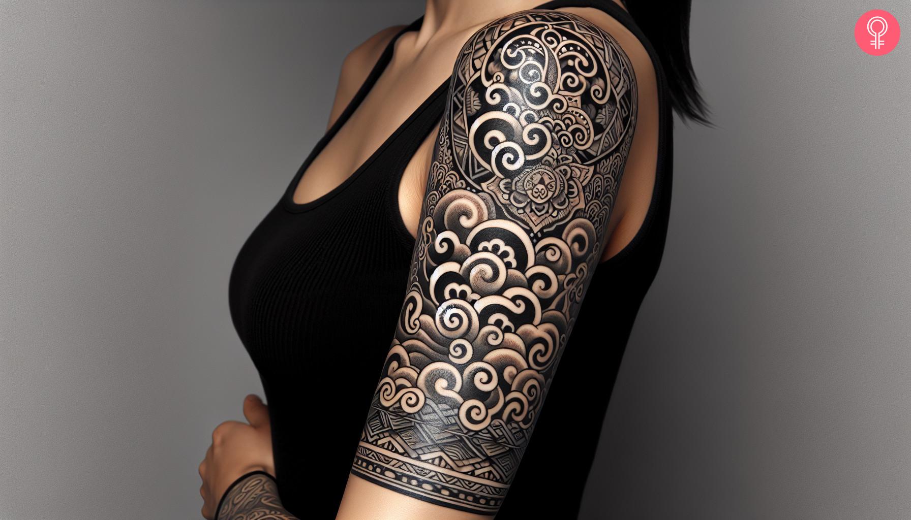 A Tibetan cloud tattoo on the upper arm